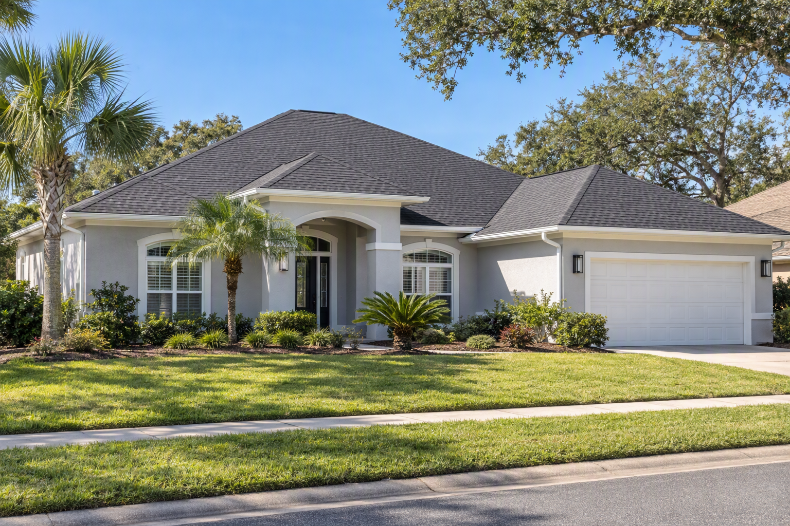 A single-story Florida house with a new charcoal shingle roof